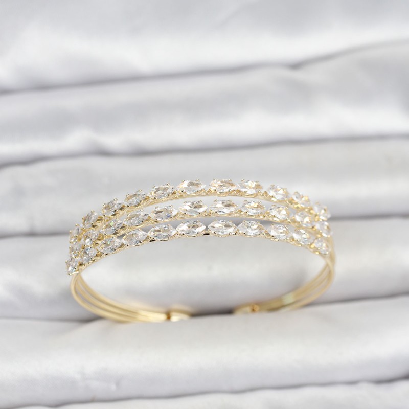 Pirinç Gold Renk Arpa Kesim Zirkon Taşlı Sıralı Model Kadın Bileklik
